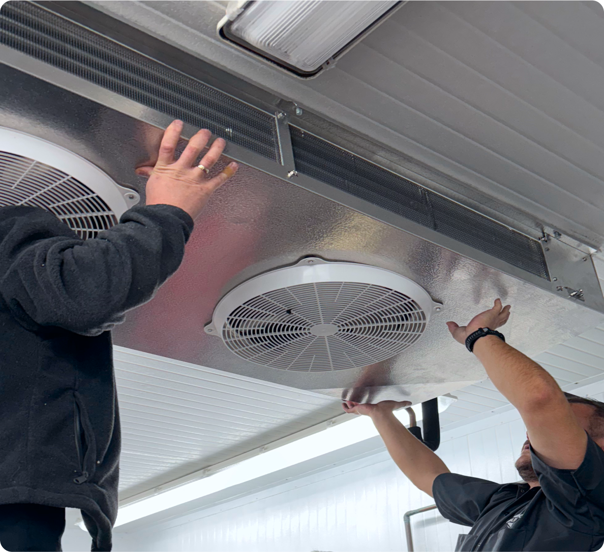 Cold Pros technicians installing upgraded commercial refrigeration components
